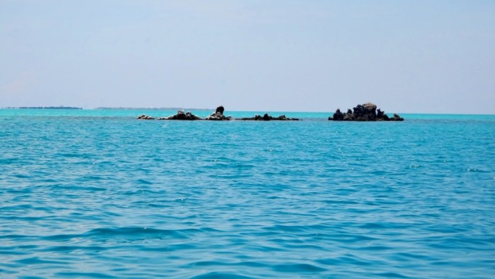 rock island, clear waters, en route to Apo Island, Sablayan, Occidental Mindoro, Philippines