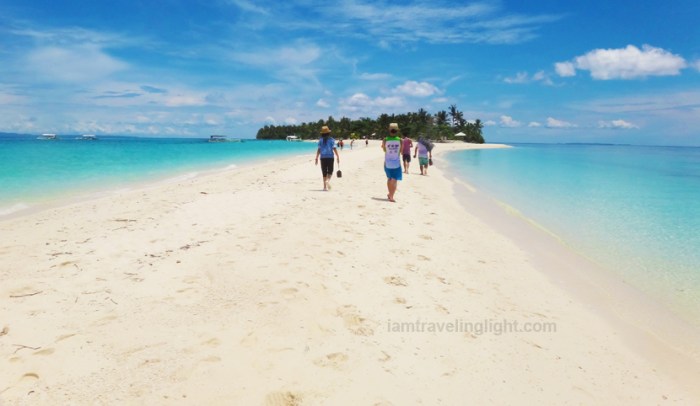 people walking Kalanggaman Island sandbar, unspoiled white beach, Palompon, Leyte, Philippines