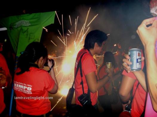 Family parade, firecrackers, drinking beer while revelry making, party, crowds, Kalibo Ati-atihan Festival 2014