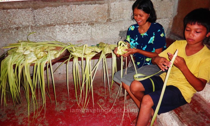 locals making puso, coconut palm leaves used to wrap rice, bohol, visayas, philippines