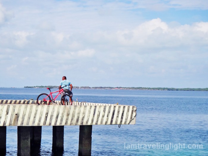 man with bike at Sibutu port, Tawi-tawi, Philippines