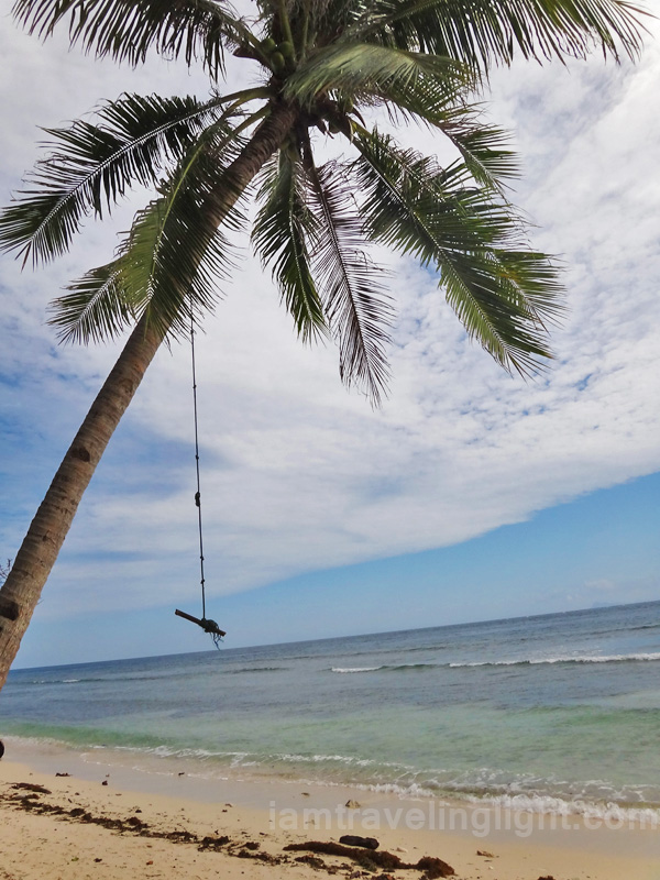 wooden swing, unspoiled white beach, remote Sibutu Island, Tawitawi, Philippines