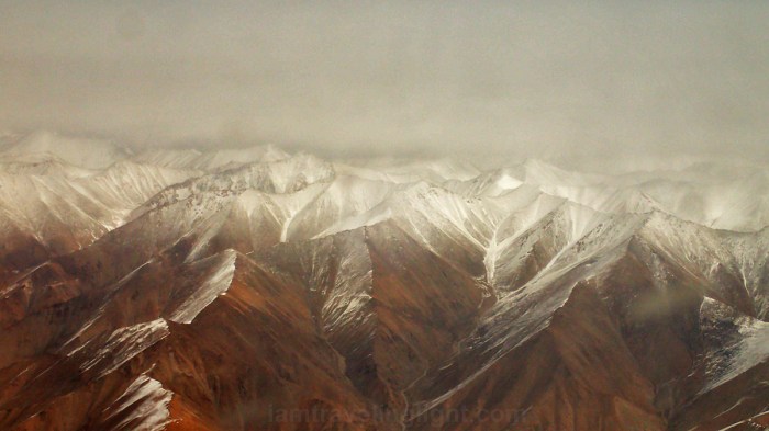 Himalayas mountain range close up, snowcapped brown mountains, like a painting, winter, view from plane, flight to Leh Ladakh, Kashmir, from New Delhi, India.jpg