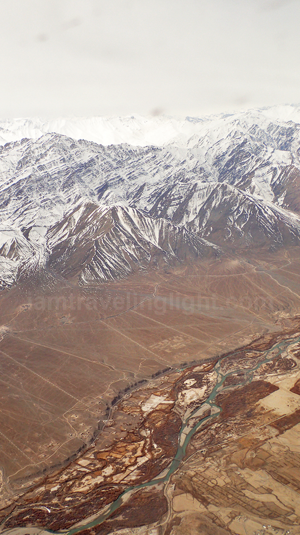 Leh town from above, river, Himalayas mountain range, snowcapped mountains, winter, view from plane, flight to Leh Ladakh, Kashmir, from New Delhi, India.jpg