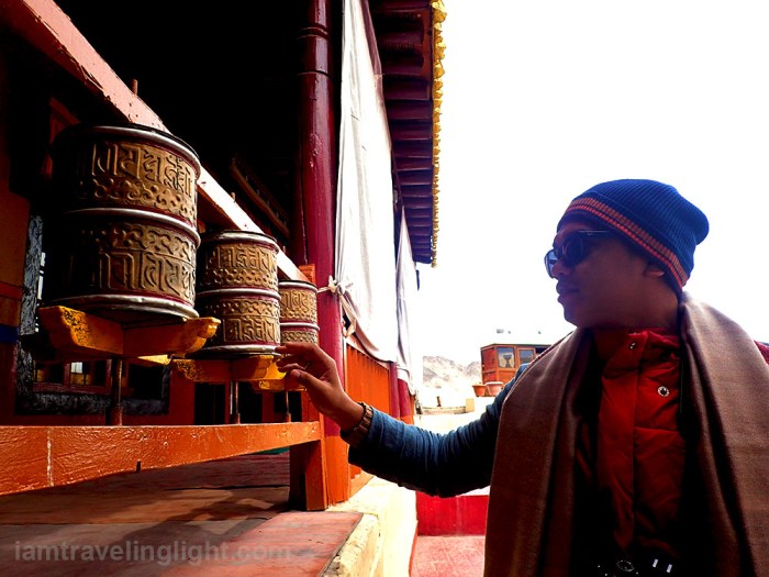 Spituk Gompa, monastery, touching and spinning prayer wheels, Tibetan Buddhism, view of Leh town, Ladakh, snowcapped mountains, Himalayas, landscape, India.jpg
