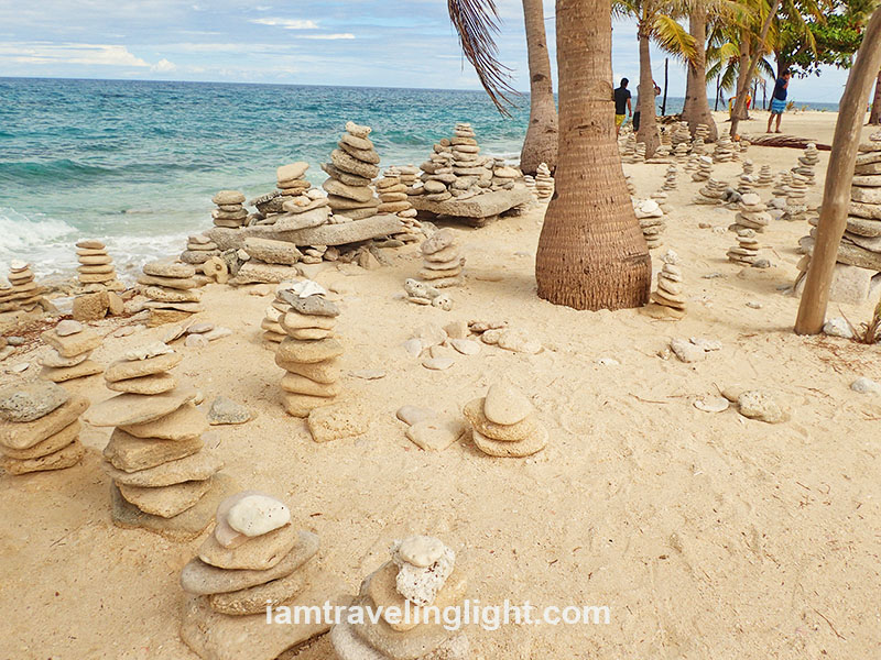 Zen piles of stones by the beach