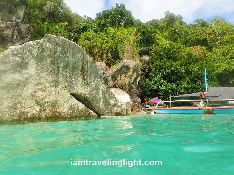 Tinagong Dagat's clear, calm waters are perfect for swimming