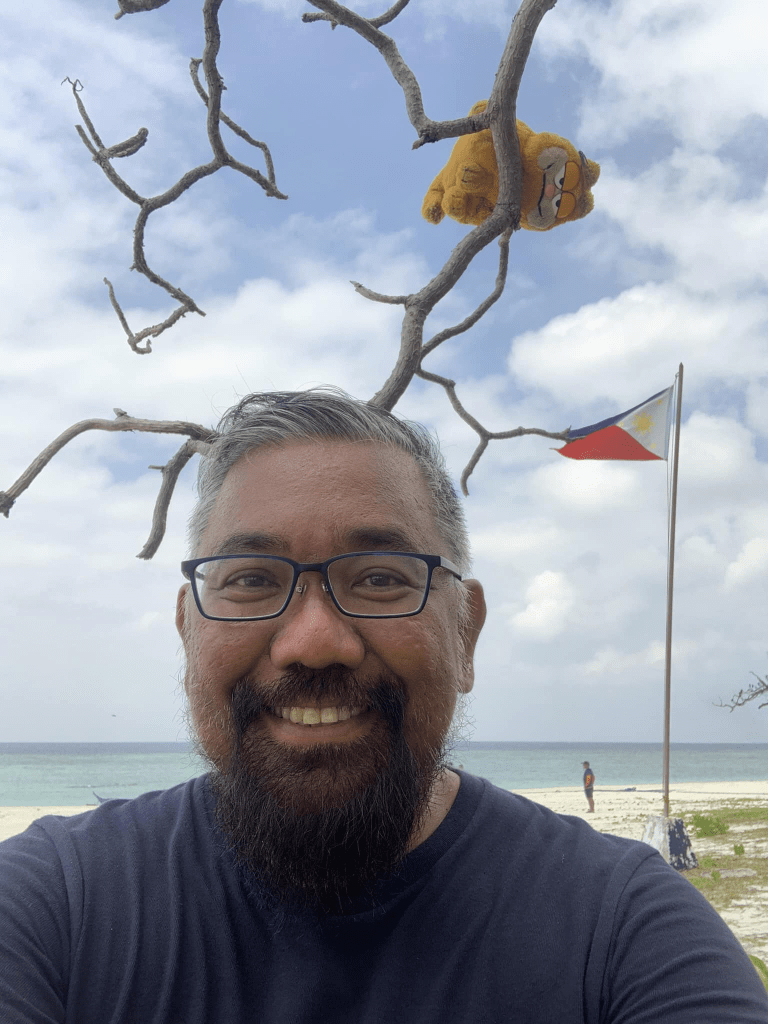 Marco Puzon, Arvid Marius Puzon, in Likas Island, Kalayaan, Plaawan. Puzon is the first person to travel to all the Philippines' 1634 cities and municipalities.